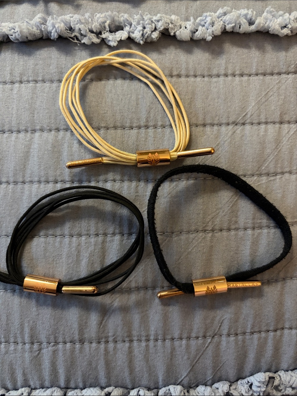 Rastaclat Cord Bracelet Set in Black & Cream with Gold Accents